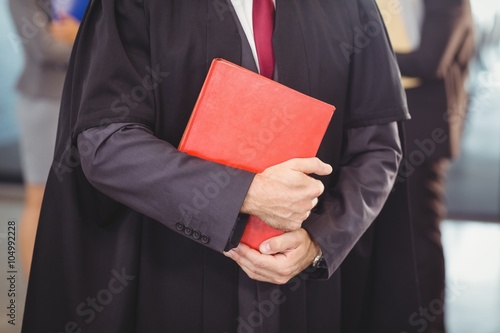 Lawyer holding a law book