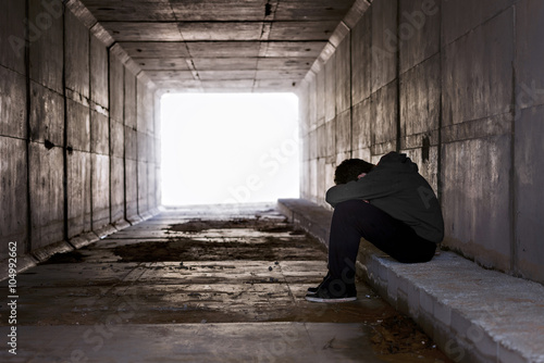 Silhouette of a boy in a tunnel
