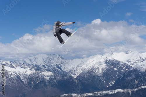 Snowboard jump on mountains. Extreme sport. © Vasily Merkushev