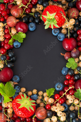 black background for text with fresh garden berries