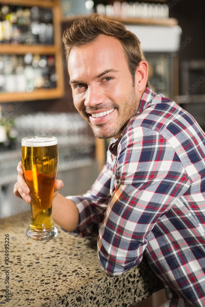 Handsome man having a beer