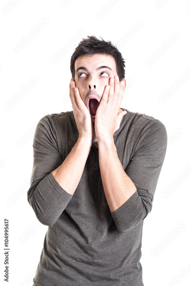 Portrait of a terrified young man on white background Portrait of a terrified young man on white background