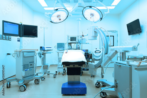equipment and medical devices in modern operating room take with art lighting and blue filter