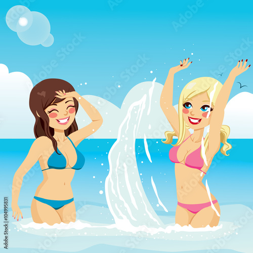 Two beautiful girls in bikini playing splattering water