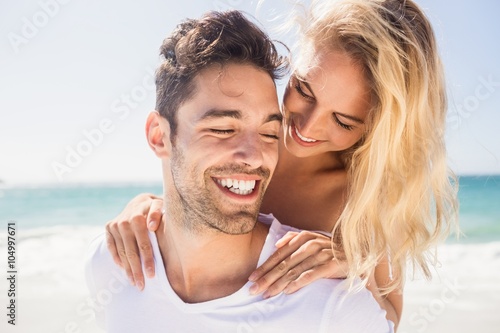 Fotografija Boyfriend giving piggy back to girlfriend