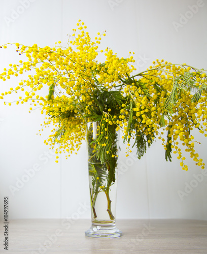 flowers in a vase on the table. Spring day. photo