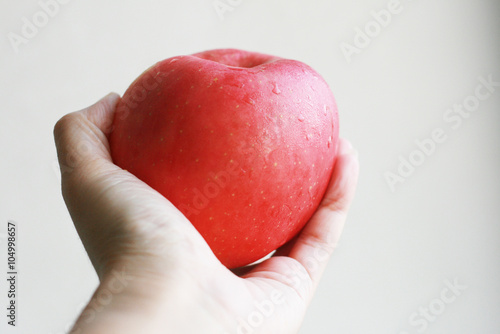 Red apple in a hand
