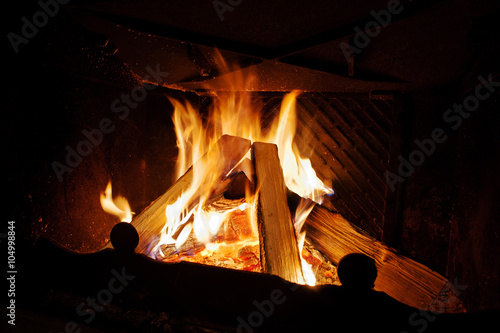 Background warm fire in the fireplace home