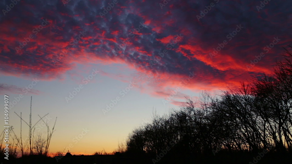 Floating beautiful clouds in the sky above the trees. Time lapse during sunset with vivid clouds.
Floating beautiful clouds in the sky above the trees. Time lapse during sunset with vivid clouds.