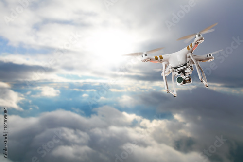 Drone for industrial works flying above clouds