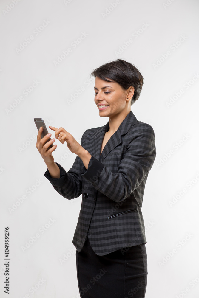 Attractive young business woman talks on her smartphone Attractive young business woman talks on her smartphone