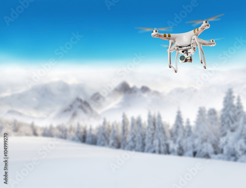 Flying drone in winter landscape © Jag_cz