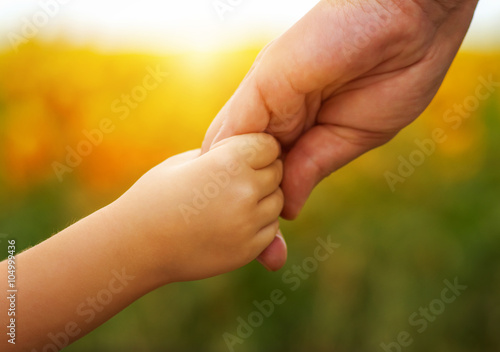 Hands of mother and daughter © Alekss