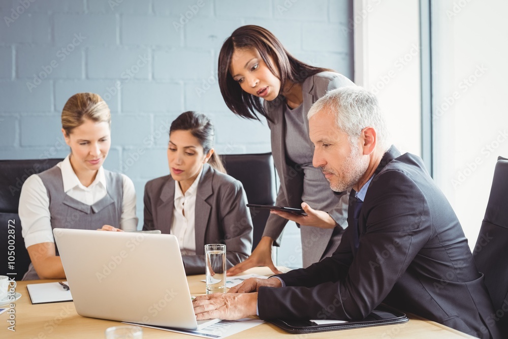 Businesspeople interacting in conference room Businesspeople interacting in conference room