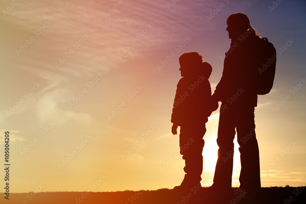 mother and son travel at sunset