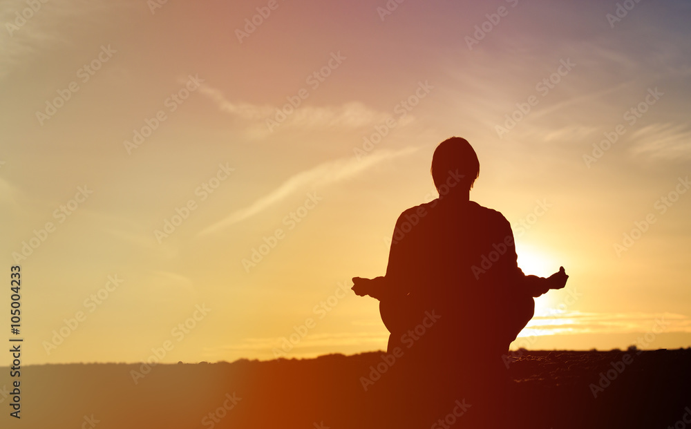 man doing yoga at sunset sky man doing yoga at sunset sky