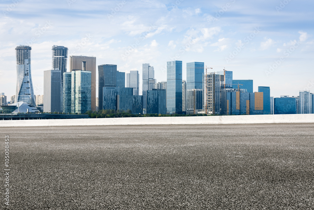 The modern urban commercial building and asphalt road The modern urban commercial building and asphalt road