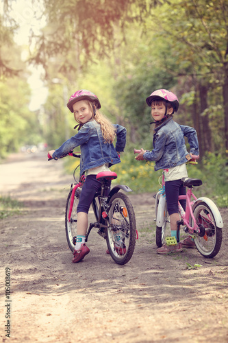 Two young girls on a bike trip