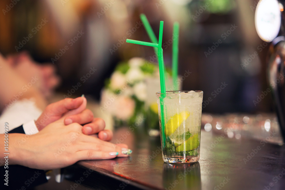 loving couple and cocktail of a mojito loving couple and cocktail of a mojito