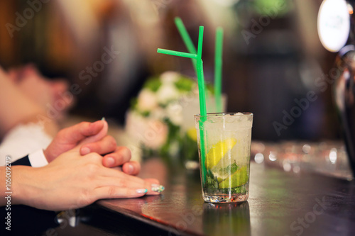 loving couple and cocktail of a mojito