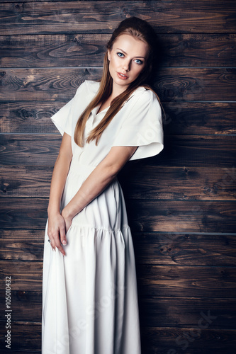 Fashion young beautiful woman in white dress