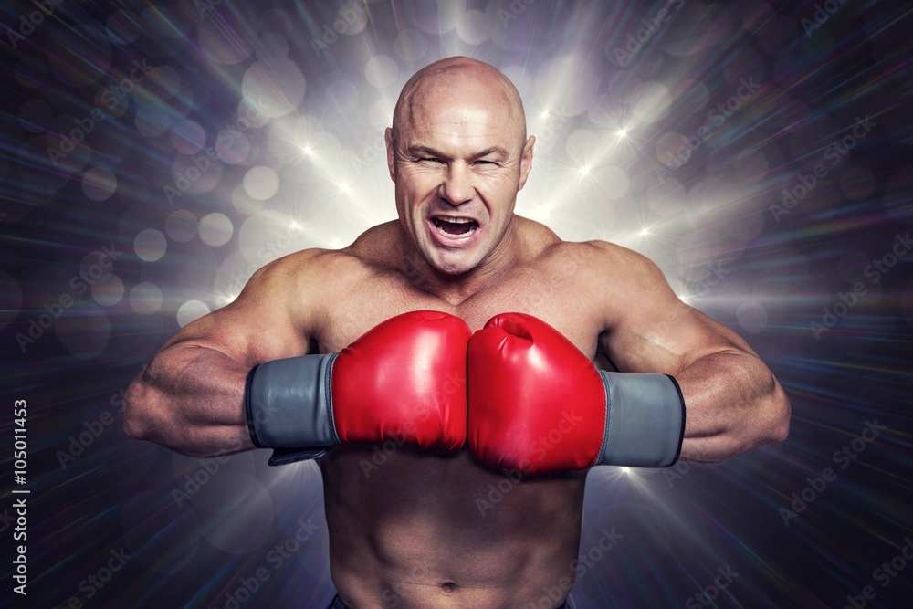 Composite image of angry bald boxer with punching gloves