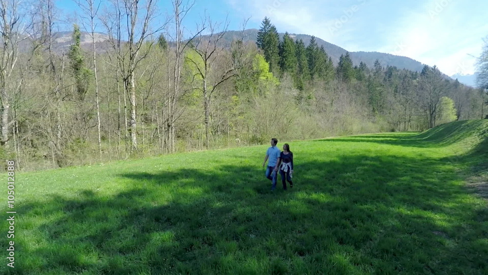 Air view on couple who walks through the nature Air view on couple who walks through the nature