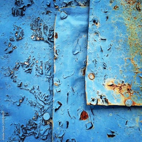 Detail of blue wall with rust