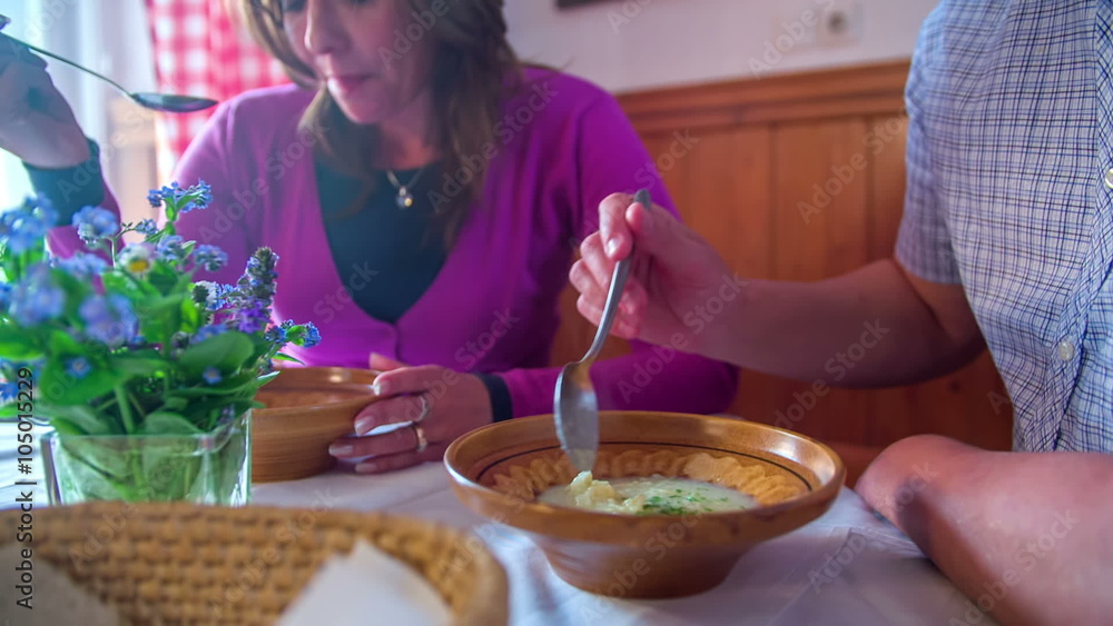 Couple eats a mushroom soup on rural tourism Couple eats a mushroom soup on rural tourism