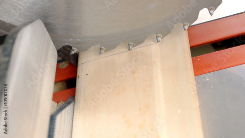 Carpenter adjusts saw blade for precise cutting