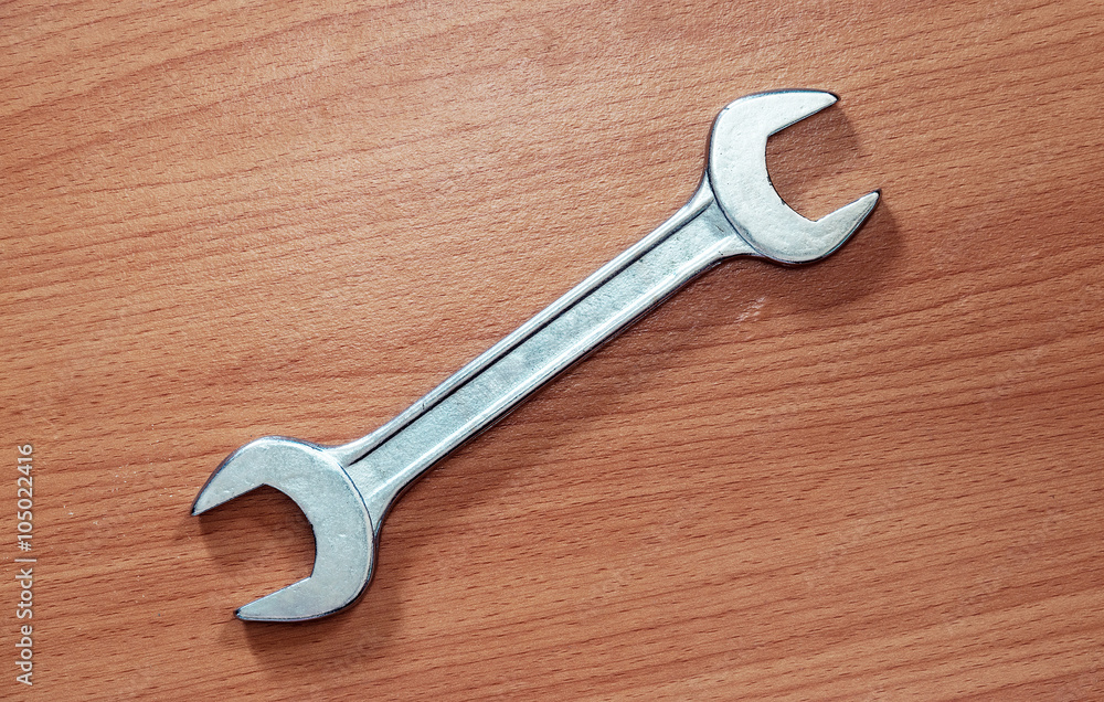 Wrench on wood background. Wrench on wood background.
