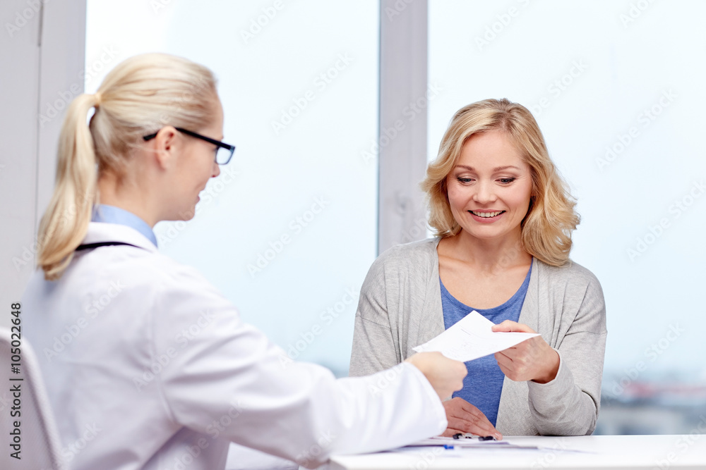 doctor giving prescription to woman at hospital doctor giving prescription to woman at hospital