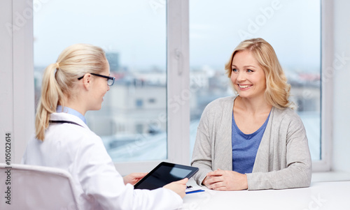 doctor with tablet pc and woman at hospital © Syda Productions