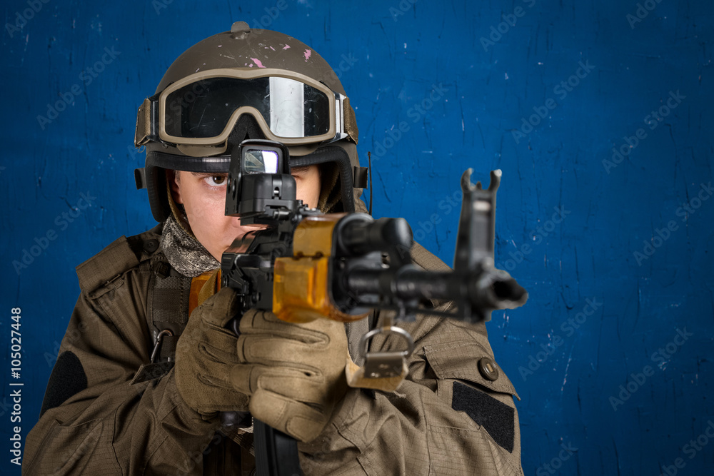 Soldier aiming a rifle