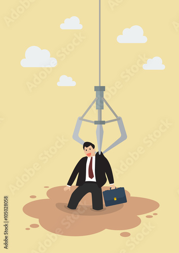 Robotic claw clutching a businessman from a quicksand