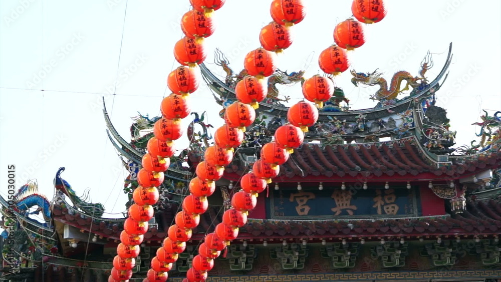 Row of red Chinese paper lanterns with ornate gold patterns and tassels ...