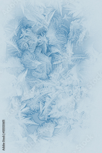 Beautiful frost pattern on a window glass (in subdued colors, retro style)