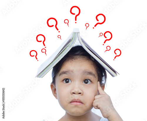 Fotografie Portrait of little Asian child thinking and put a book on top