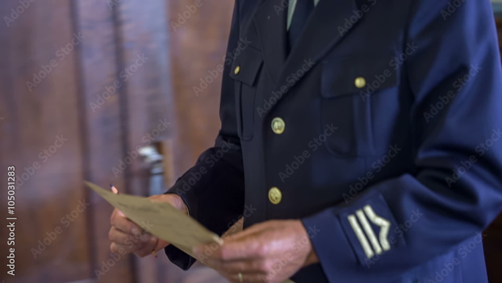 Woman giving a document to the conductor 