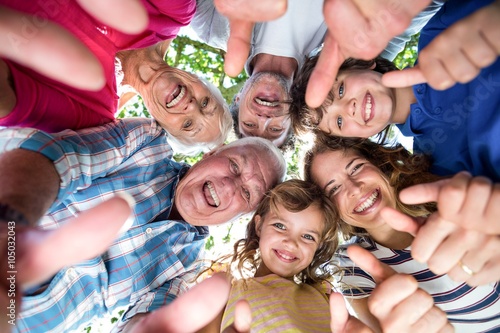 Smiling family standing in a circle