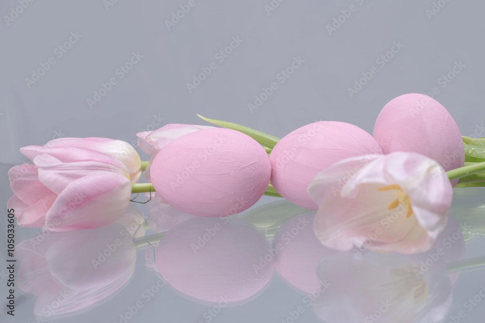 Pastel pink Easter eggs and tulips 