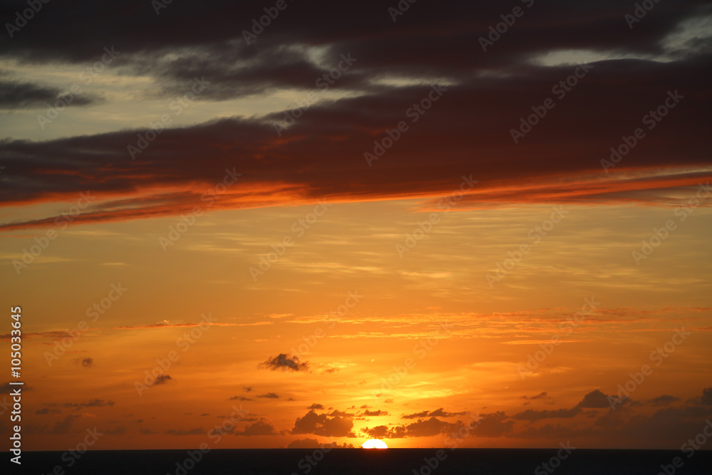 TROPICAL SUNSET OVER SEA