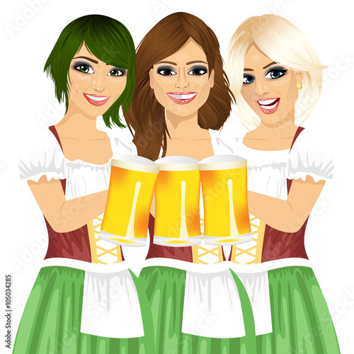 three beautiful waitresses holding beer mugs for oktoberfest party toasting wearing a dirndl