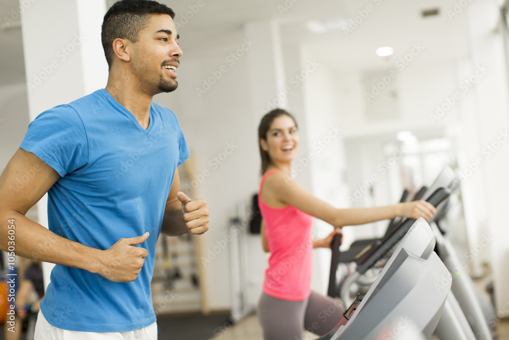 Young people training in the gym Young people training in the gym