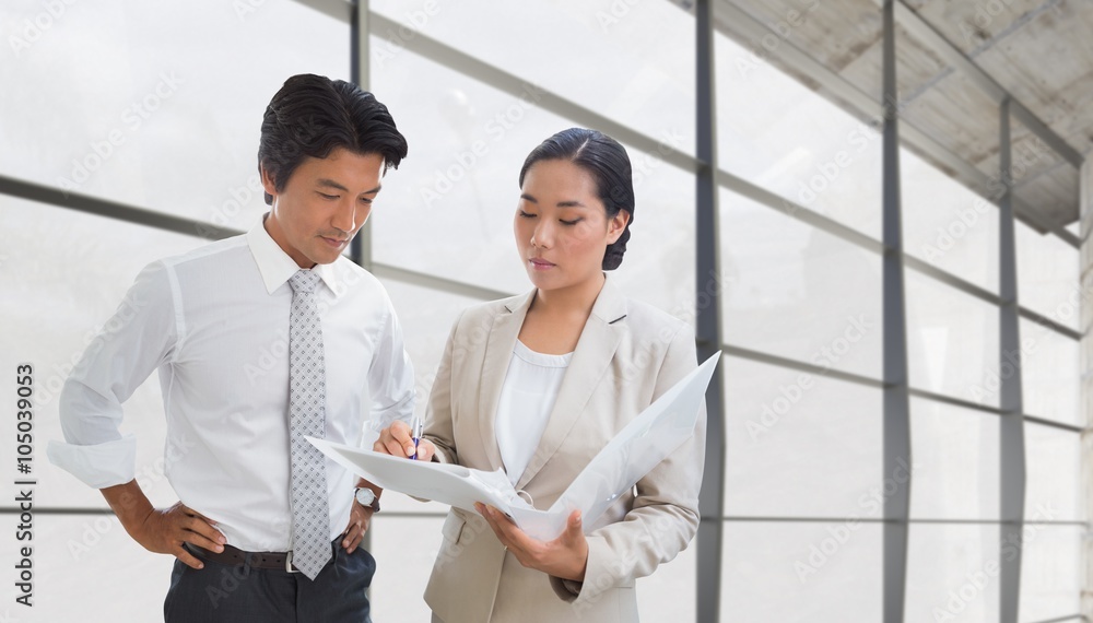 Composite image of estate agent showing lease to customer Composite image of estate agent showing lease to customer
