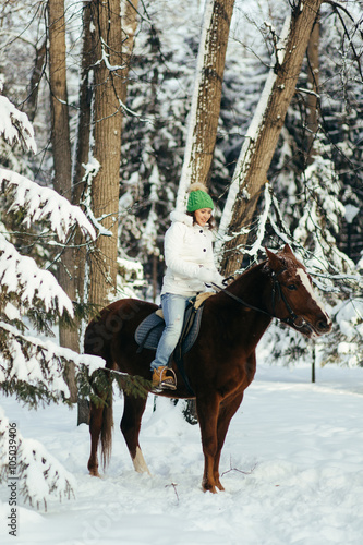 beautiful girl and horse in winter