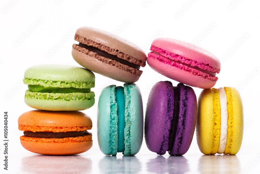 Collection of brightly colored French macarons on white backgrou Collection of brightly colored French macarons on white backgrou