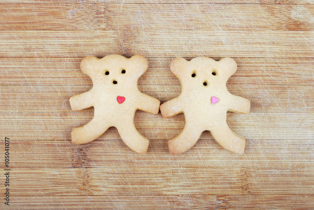 Homemade cookies in the shape of a little bear on a wooden board Homemade cookies in the shape of a little bear on a wooden board