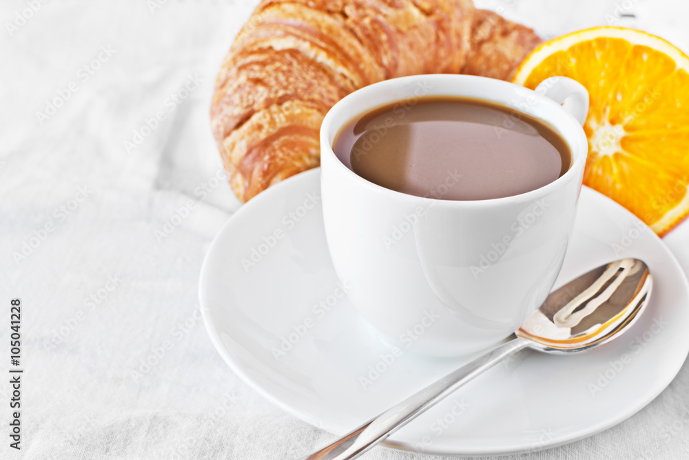 Cup of coffee,orange and croissant. Cup of coffee,orange and croissant.