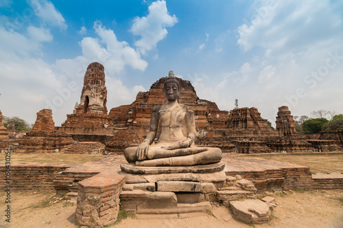 Ancient ruin and buddha statue in Mahathat temple of Thailand.